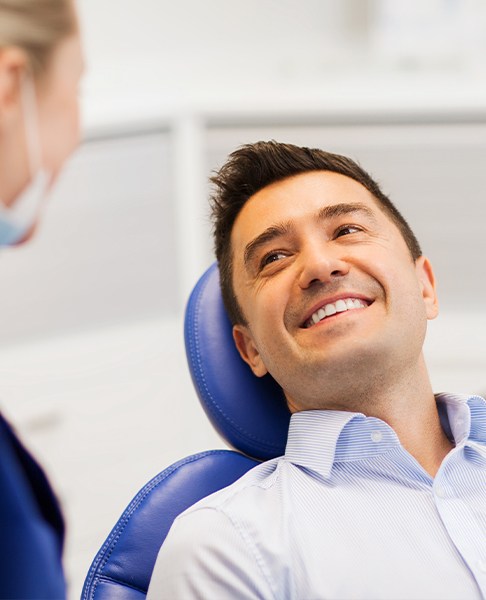 Man smiling at periodontist