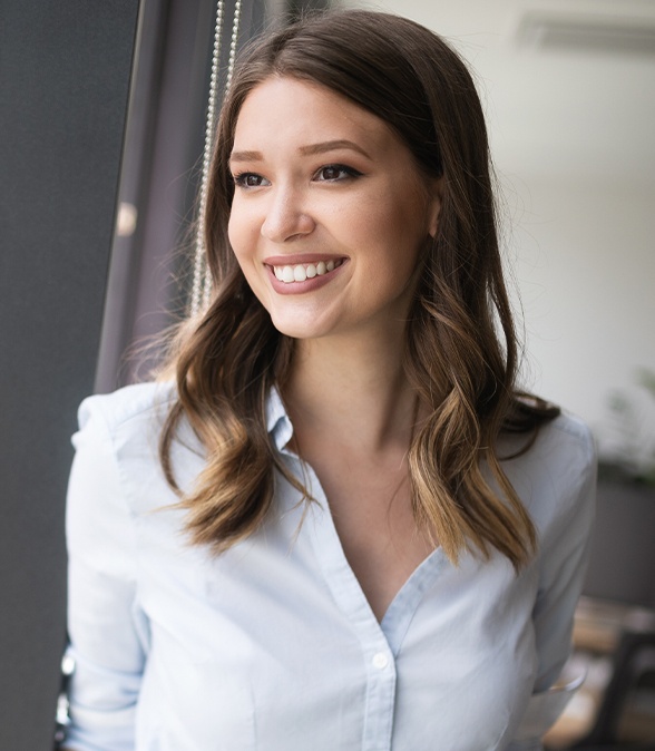 Woman with flawless smile after cosmetic periodontics