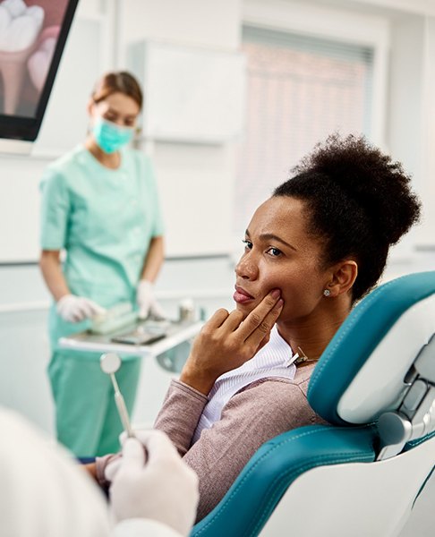 Woman in dental chair with a toothache