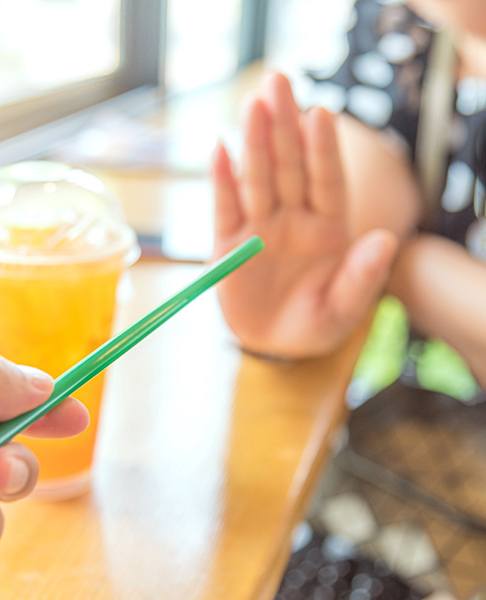 Woman rejecting a straw