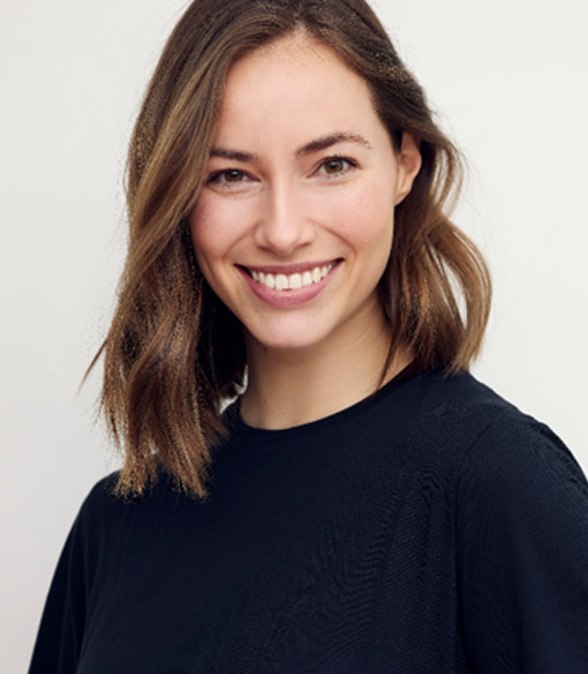 Woman with beautiful smile after gum grafting in Dallas