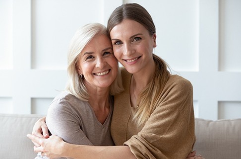 Senior woman and younger woman, both potential dental implant candidates