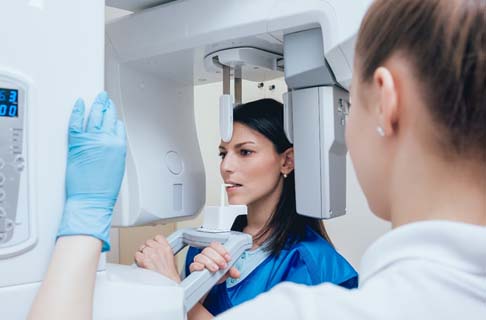 Woman at Cone Beam Scanner in Dallas 