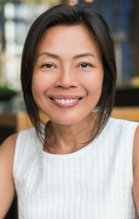 Close-up of smiling woman with sweater