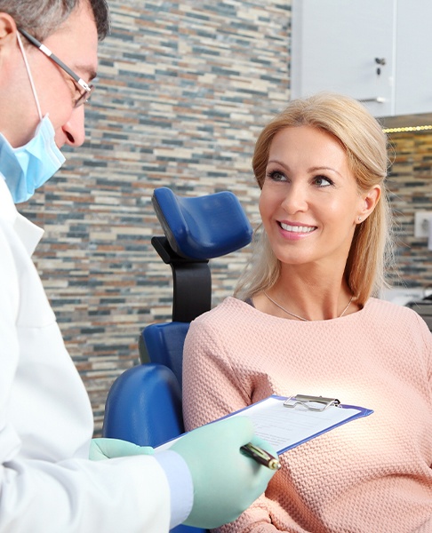 Patient discussing periodontal maintenance with periodontist