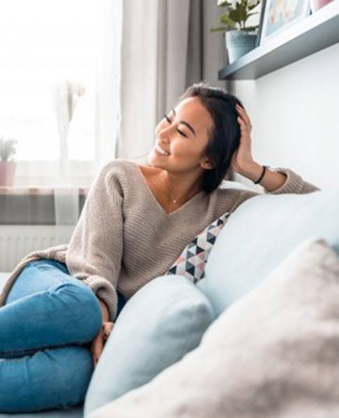 a person relaxing on their couch