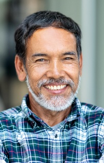 Man with healthy smile after periodontal therapy