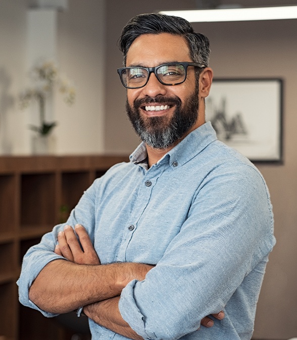 Man smiling after receiving treatment using advanced dental technology