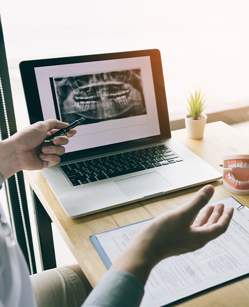 Dentist and patient reviewing digital x-rays