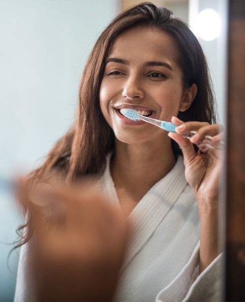 Woman brushing teeth