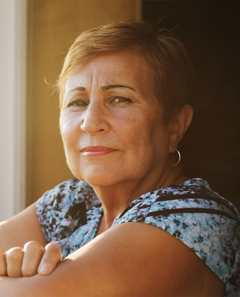 Woman smiling after visiting the periodontist