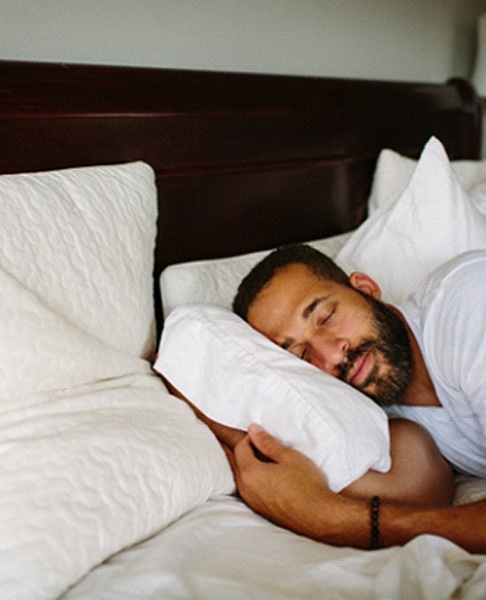 Man resting after completing wisdom tooth extraction in Dallas