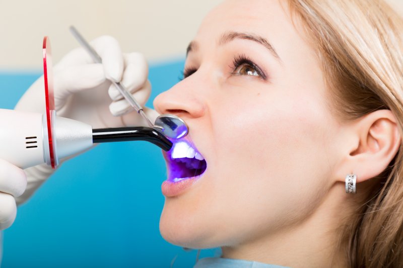 A young woman undergoing cosmetic bonding in Dallas