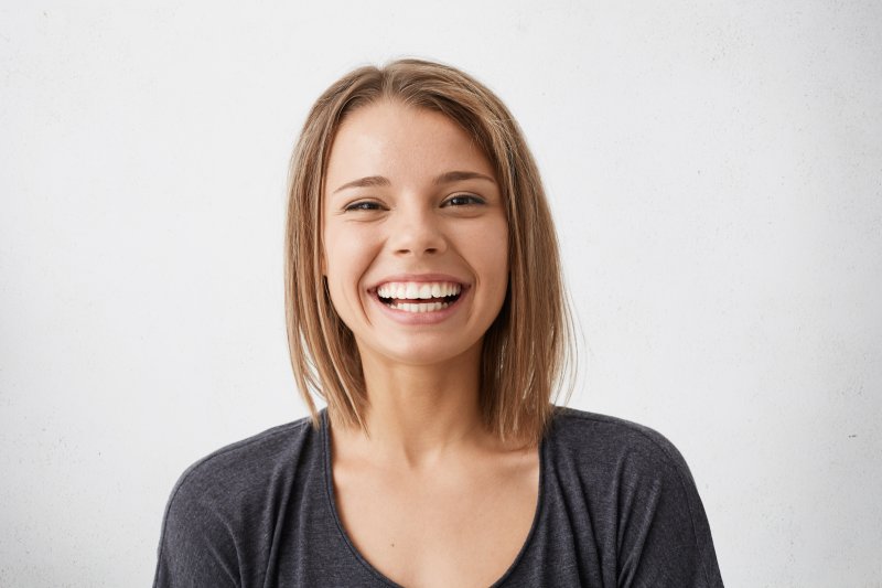 patient smiling after wisdom tooth extraction